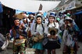 Dancing devotees with mask in the streets of the town the procession of the Virgin of Carmen -.Catholic religion