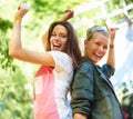 Dancing to the beat of their own drum. Two joyful young women dancing outside. Royalty Free Stock Photo