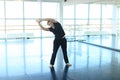 Dancing trainer doing warm up at studio. Royalty Free Stock Photo