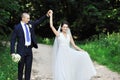 Dancing wedding couple in a park Royalty Free Stock Photo