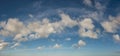 Dancing white and silver clouds, panorama format Royalty Free Stock Photo