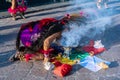 A dancing woman is blowing the altar in homage to the Virgin of Zapopan.