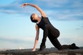 Dancing woman over blue sky. Yoga Royalty Free Stock Photo