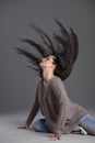 Dancing woman swinging hair