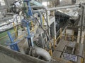 Pulper or pulping machine inside paper manufacturing plant. Paper pulp is being