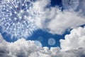 Dandelion against the blue sky in the clouds. Blowball fly in the wind and symbolize ease of mood and easy laid-back background.