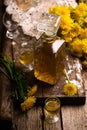 Dandelion Cordial in glass bottle .style vintage Royalty Free Stock Photo