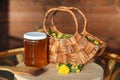 Dandelion Jelly and wooden basket of dandelion Flowers in the rays of the evening sun