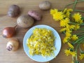 Dandelions flowers with potatoes and onion burgers Royalty Free Stock Photo