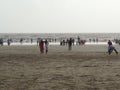 Tourists enjoying at Dandi Beach at dawn - Gujarat tourism - India beach holiday Royalty Free Stock Photo