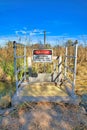 Danger Authorized Personnel Only Beyond This Point sign hanging at Sweetwater Wetlands, Tucson, AZ