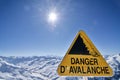 Danger avalanche sign in French Alps Valmeinier mountains in winter skiing area in the Savoie Royalty Free Stock Photo