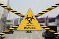 Danger biohazard sign at the closed airport due to Coronavirus