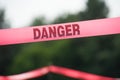 Danger Boundary Tape in a Field.