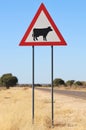 Danger - Cattle (Cow) Crossing Road Sign - Drivers be Cautious and Alert Royalty Free Stock Photo