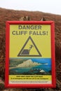 Danger cliff falls sign in South Downs National Park, East Sussex, United Kingdom. Royalty Free Stock Photo