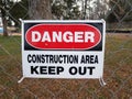 Danger construction area keep out sign on fence Royalty Free Stock Photo