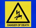 Danger of death from electricity sign on blue background