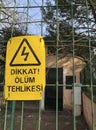 Danger of death sign on fence in Turkish