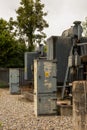 Danger of Death warning triangle with Electricity symbol on transformers at substation. Norfolk, UK - August 5th 2020