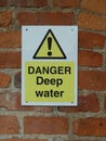 Danger Deep water sign on a brick wall