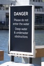 DANGER deep water sign at Canary Wharf, London.