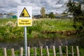 Danger Deep Water warning sign by rural waterway river hazard. Risk of drowning Royalty Free Stock Photo