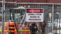 Danger, demolition work in progress sign in a real construction site Royalty Free Stock Photo