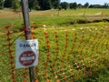 Danger do not enter sign and orange fence on golf course Royalty Free Stock Photo