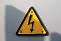 Danger electrical hazard high voltage sign, black triangle with yellow color