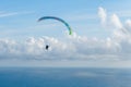 Danger extreme flying tandem paraglider over the sea