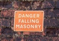 Danger Falling Masonry sign on a old red brick building Royalty Free Stock Photo