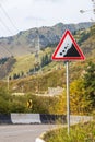 Danger falling stones. Landslide road sign in the mountains, Almaty, Kazakhstan