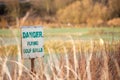 Danger flying balls a funny golf sign near golf course