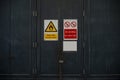 Danger highly with No smoking  sign and door photo Royalty Free Stock Photo