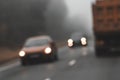 Danger on highway due to intoxication in dark during cloud weather. Driver fatigue. Blurred image of cars. Sleeping while driving Royalty Free Stock Photo