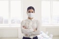 Danger of infection of the virus coronavirus infection. Businesswoman in medical mask at office