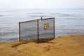 Danger warning sign by ocean Royalty Free Stock Photo