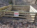 Danger keep off sign on wood fence around mine entrance Royalty Free Stock Photo