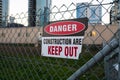 `Danger, keep out, construction area` sign on the fence. Royalty Free Stock Photo