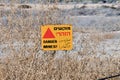 Danger Mines sign on a fence in Israel at Qasr el Yahud site Royalty Free Stock Photo