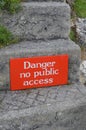 Danger no public access sign on stone step. Royalty Free Stock Photo