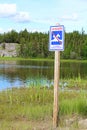 A danger, no swimming sign in both english and french Royalty Free Stock Photo