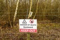 Danger quicksand sign on a wire fence.