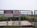 Danger, Restricted Area Sign on wire mesh fence