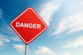 Danger road sign with blue sky and cloud background Royalty Free Stock Photo