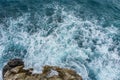 Danger sea ocean wave crashing on rock coast with spray and foam Royalty Free Stock Photo