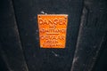 Danger sign on a black door Royalty Free Stock Photo