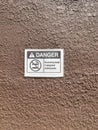 Danger sign for no smoking area stick on concrete wall