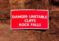 Danger sign on red cliffs in Sidmouth, Devon Royalty Free Stock Photo